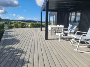 Photo of patio deck with Permadeck decking, blue sky and deck chairs