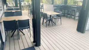 indoor-outdoor flow decking with tables and chairs